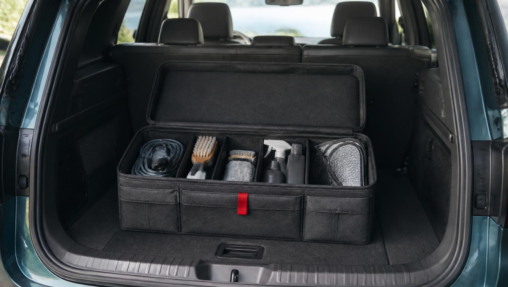 Charcoal trunk organizer holding practical vehicle accessories